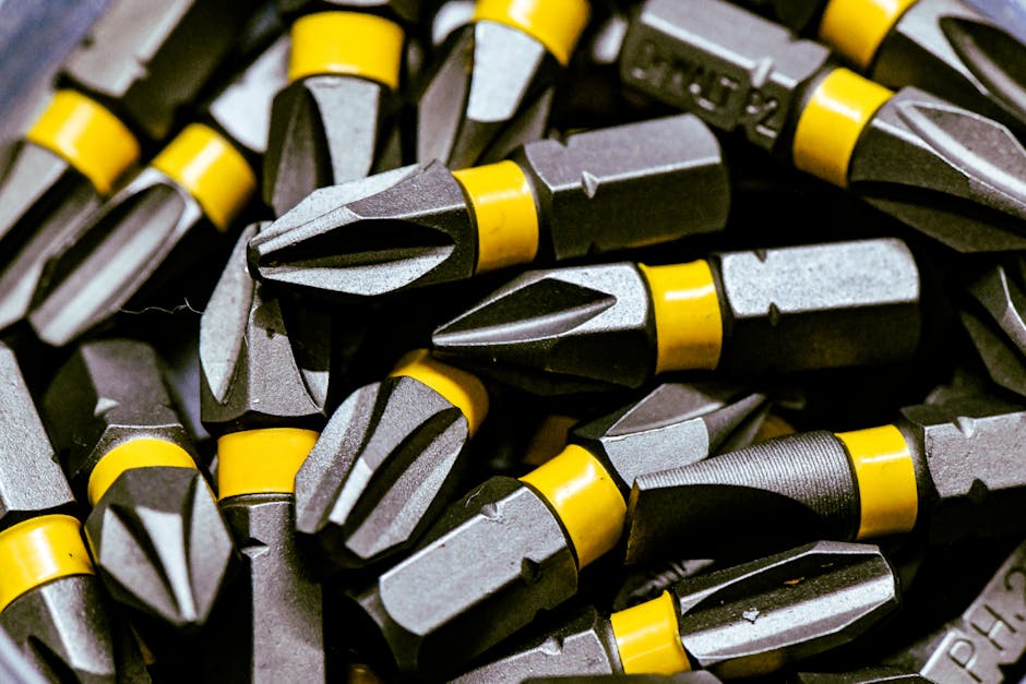 Detailed image of steel screwdriver bits with yellow bands.