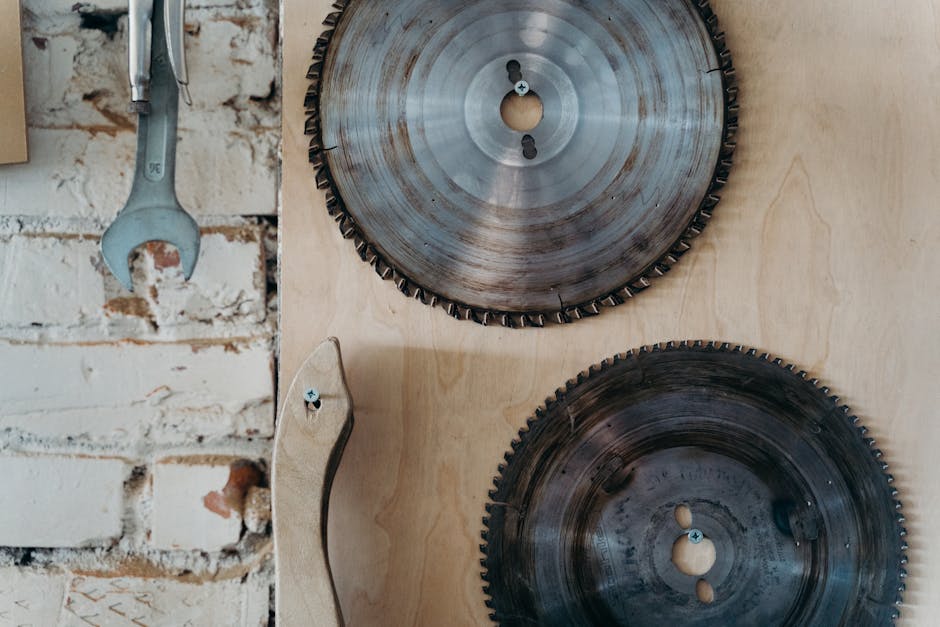 Detailed view of circular saw blades mounted in a workshop setting. Ideal for industrial themes.