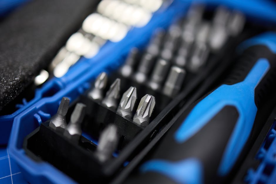 Detailed view of a screwdriver bit set in a blue plastic case, perfect for precise DIY tasks.