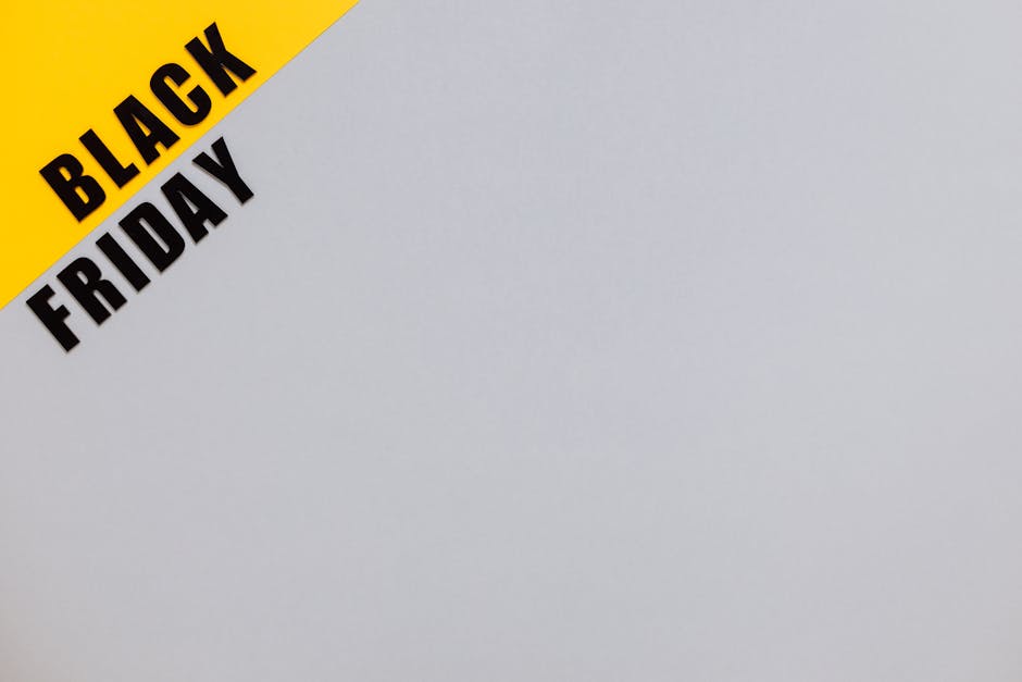 Minimalistic Black Friday banner on yellow and gray background with copy space.