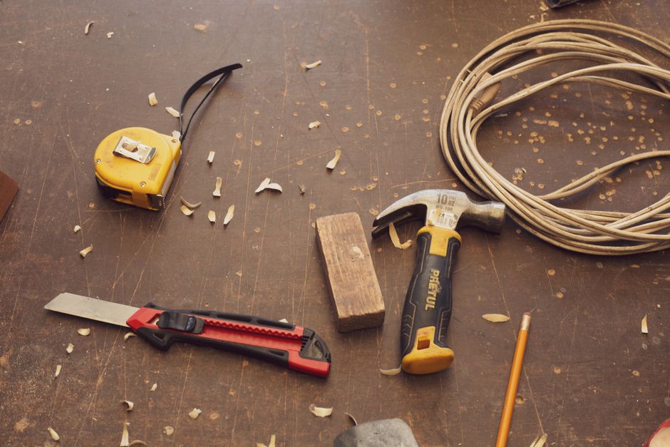 A detailed view of carpentry tools on a workbench in a Mexican workshop.