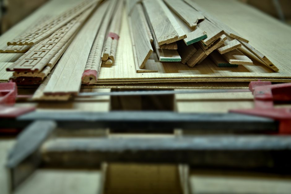 Close-up of woodworking tools and wooden planks on a workbench in Fès, Morocco.