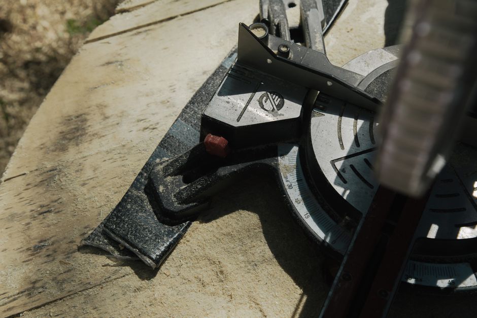 Close-up view of a circular saw on a wooden surface for carpentry and woodworking tasks.