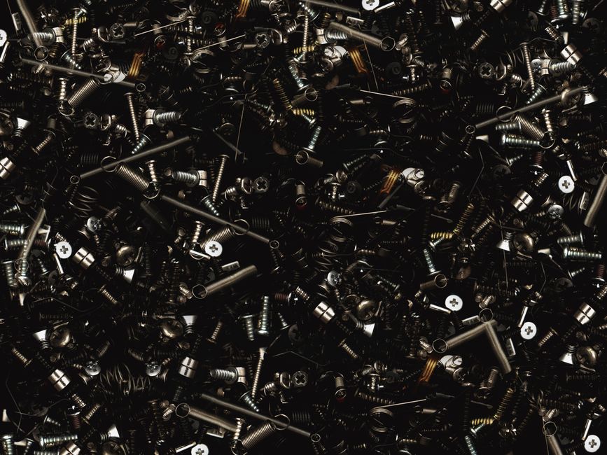 A detailed close-up view of various metal screws and bolts, showcasing industrial hardware.