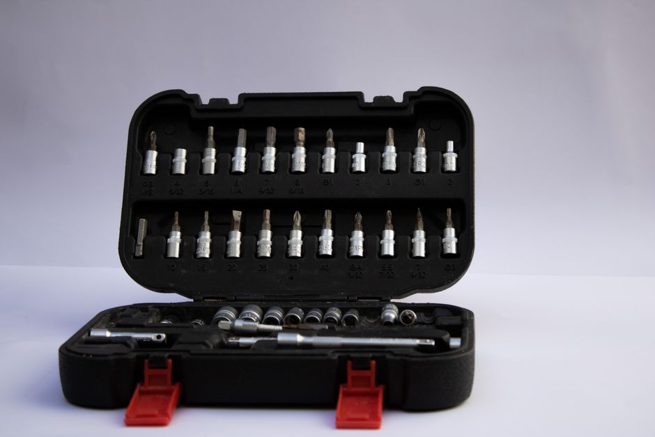 Open toolbox with assorted screwdriver bits and hand tools for versatile use.